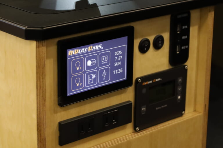 ダイレクトカーズのオリジナルスイッチパネル。照明や電気製品が効率良く操作でき、サブバッテリーの残量も一目でわかる。｜「そんなのアリ…？」「これは住めちゃう車」ソファみたいなシートが素敵。キッチン・冷蔵庫・電子レンジ装備。