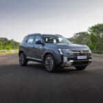 Front three-quarter view of the Nissan Tekton highlighting its bold SUV design, grille and alloy wheels.