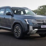 Front three-quarter view of the Nissan Tekton highlighting its bold SUV design, grille and alloy wheels.
